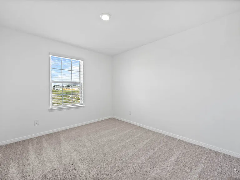Each bedroom features lush carpet flooring.