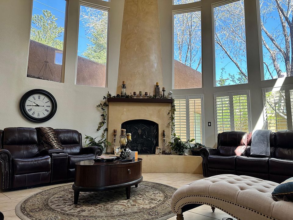Formal living room with plenty of natural light and gas log fireplace