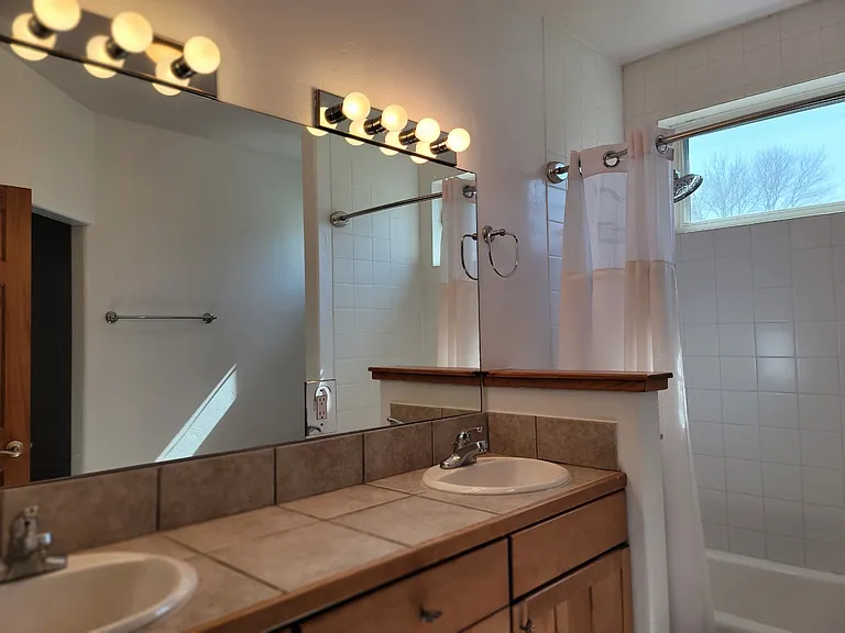 Master bathroom closet entry is to the right of the photo