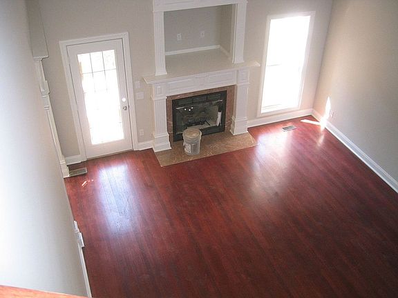 Great room with rich hardwoods and fireplace
