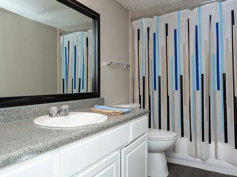 Updated bathroom vanity with modern lighting and storage