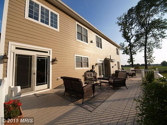 Deck w/bump-outs spans entire rear of the house