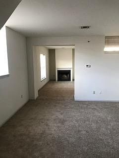 Living Room with Den & Wood Burning Fireplace