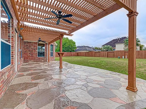 The covered back porch ends off the Family Room to an extra large backyard that is large enough for a pool and so much more.
