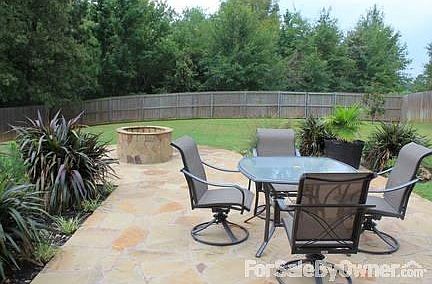 Stone patio, rock fire pit, great landscaping, Nice backyard