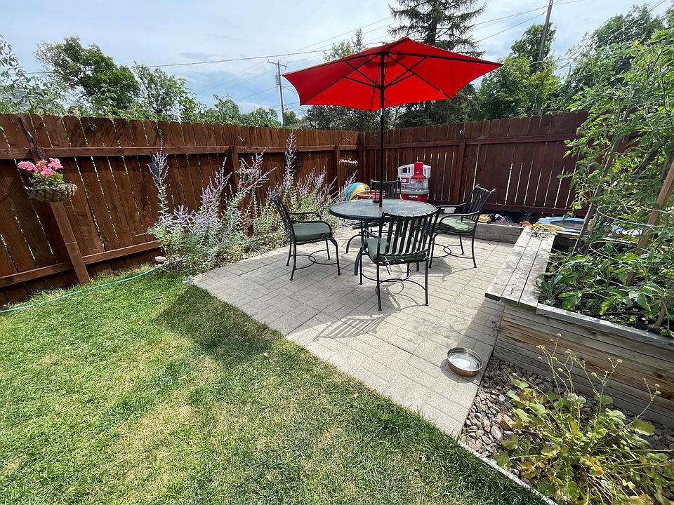 Fenced back yard features grass lawn, perennial bed, and space for a vegetable garden if you like. Fenced in, so it works great for pets and there is a dedicated area for pet relief.