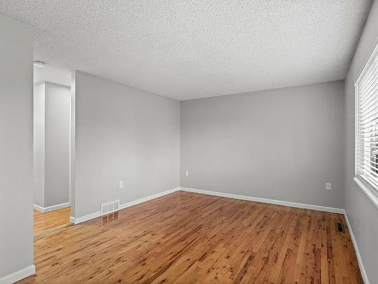 Experience the warmth of natural light in this inviting living room. Experience the warmth of natural light in this inviting living room.