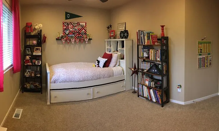 Bedroom #2 w/recessed lighting & ceiling fan. Backyard view.