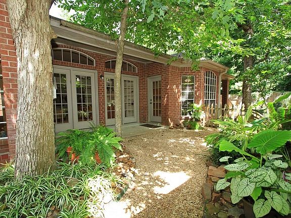 Full length windows from the Living Room, Breakfast/kitchen and Master Suite overlook this tranquil 