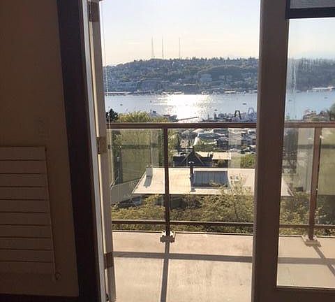 French doors to small balcony overlooking Lake Union
