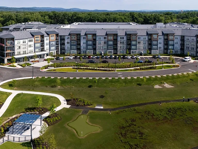 Building exterior with putting green and gazebo