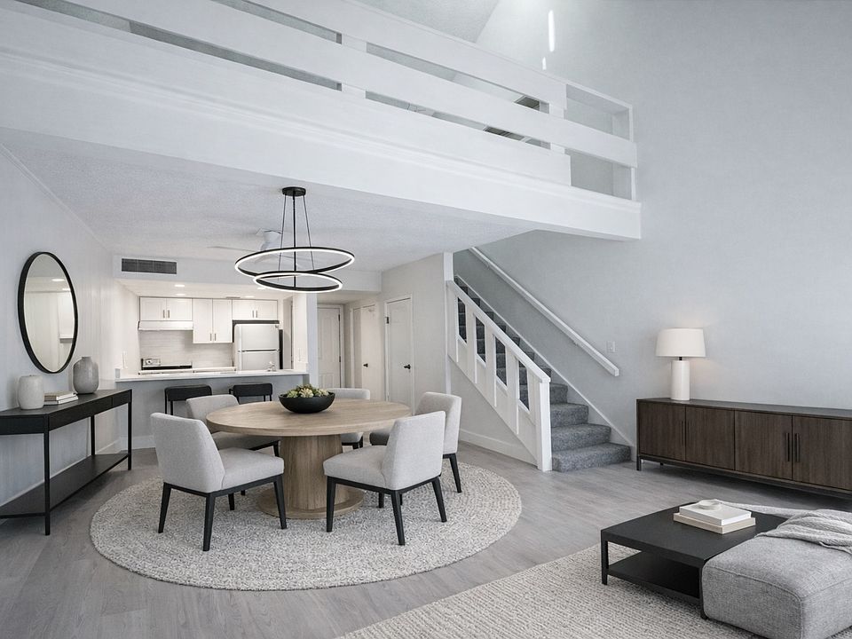 Open-plan, two story loft with 1.5 bathrooms, private terrace and upgraded kitchen with quartz countertops. (Virtual Staging)