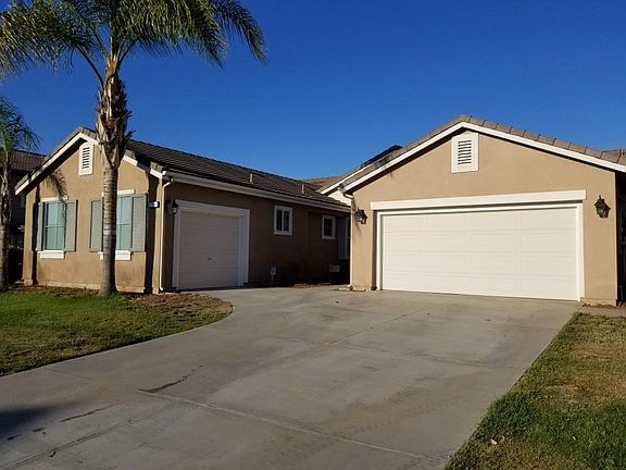 Driveway with 3-car garage to park your toys