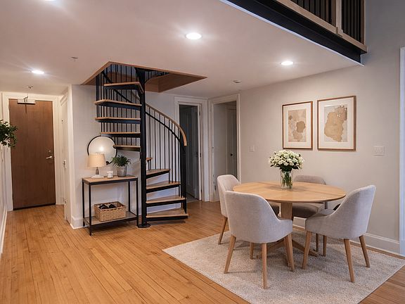eating area/ entry/ staircase to loft (this photo has been virtually staged)