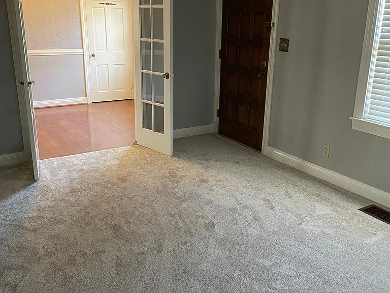 Living room area with a view of the dining room.