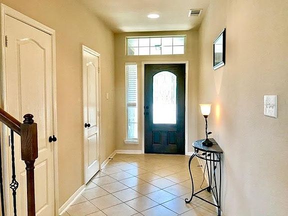 Upon entering the spacious entry the half bath and hall closet is close by.