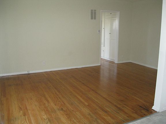 Living room with refinished hardwood flooring