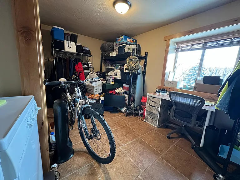4th Bedroom/Storage room with the laundry closet and jumbo closet - Usually people use this room for gear, an office or laundry/craft room
