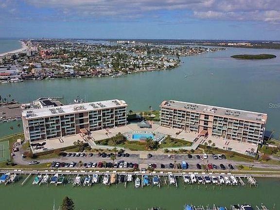 Marina on one side with guest parking.