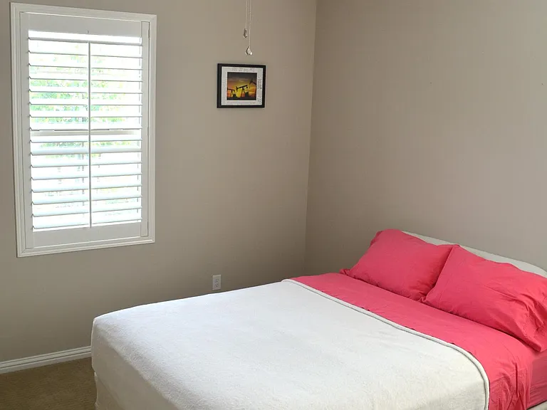Bedroom 4 - located in west wing of the house next to full bathroom with double sink and separate bath area