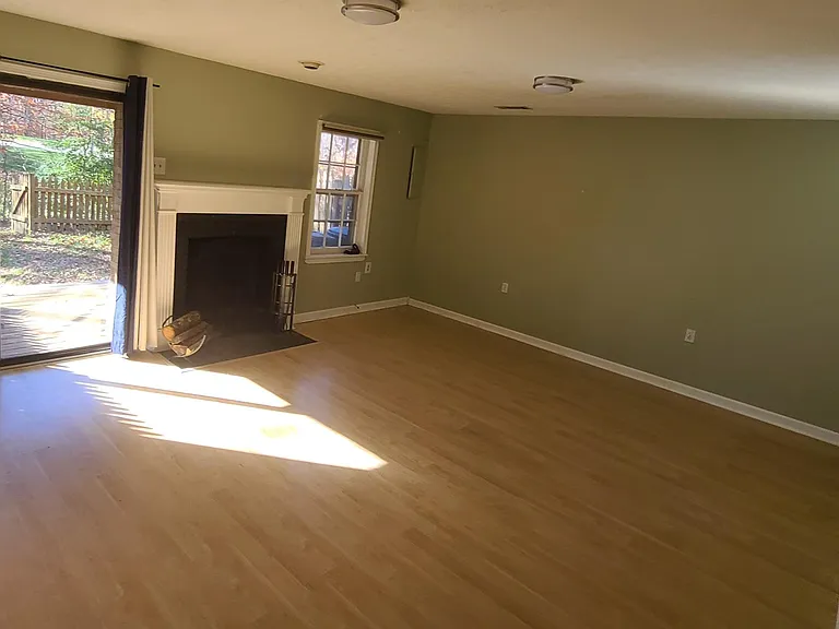 Basement - the patio door walks outback to lower deck, fenced in yard facing wooded lot