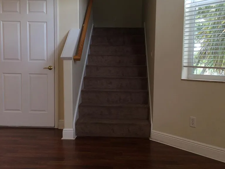 stairway to 2nd floor and 2 of the 3 bdr.