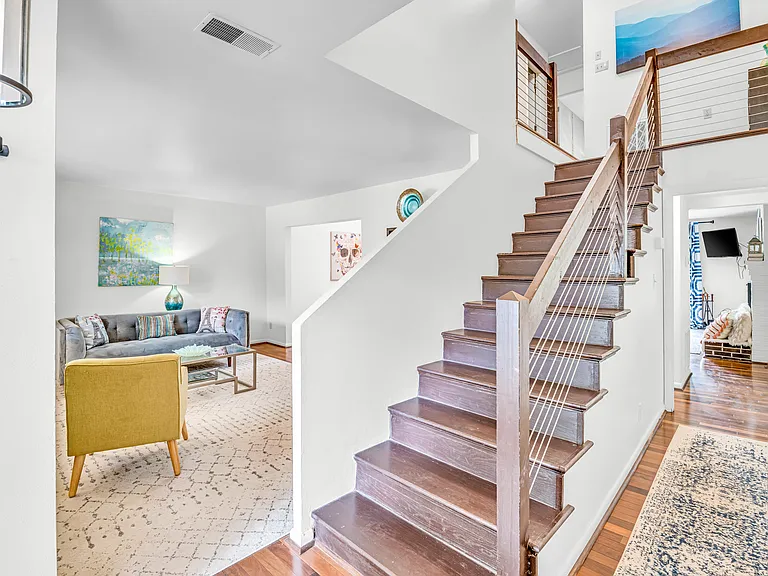 Entryway with living room to left and family room to the back.