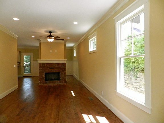 Wide open spaces... just what everyone wants living room separated from dining room by floating wood