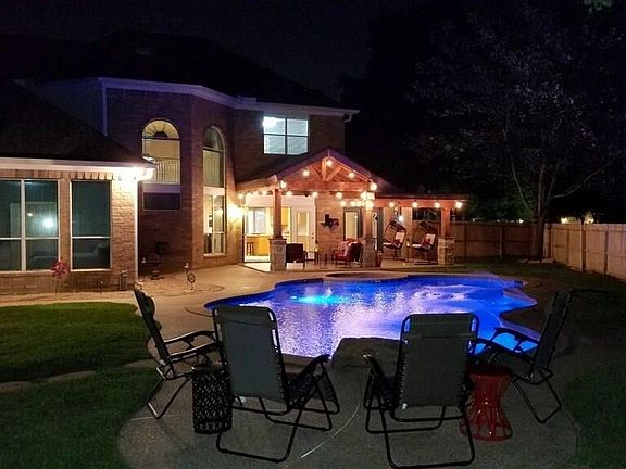 This could be your very own relaxing space amongst the mature trees and bird chirping.   Beyond quiet and serene and of course, beautiful.    Pool has color changing LED lights for a little pizazz.   This custom designed cedar back covered patio is a dream with it's wood looking tile plank floors.   It opens up to not only the kitchen/breakfast room but also the sunroom!