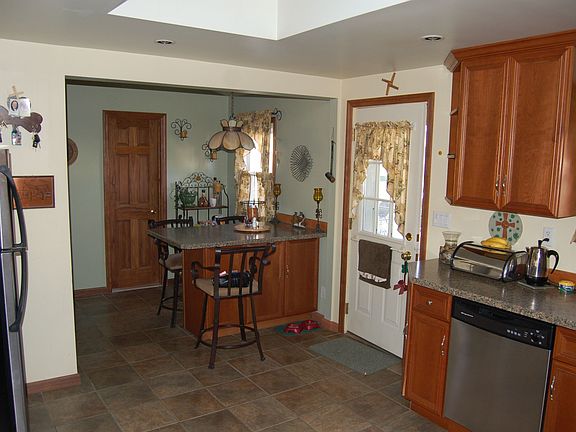 ALL NEW KITCHEN LEADING TO BACHYARD