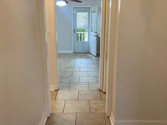 Front entrance through hallway & kitchen to back door
