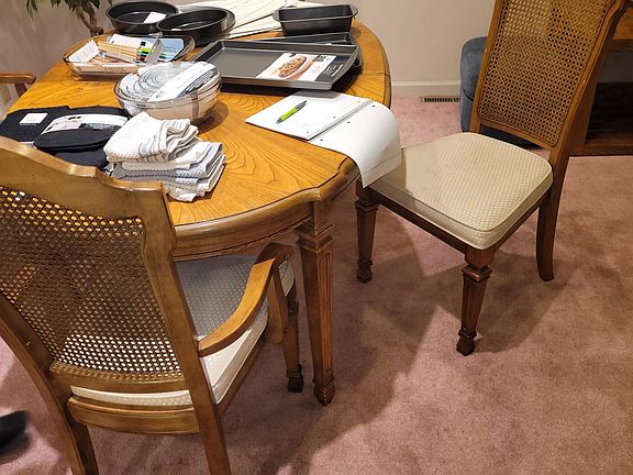 Dining table with some of the new kitchen items and towels. (Old carpet has been replace with LVP)