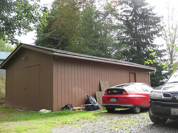 20' x 30' garage. Interior storage shelves and possible cabinets. More photos to come after 9/30 when tenants have moved.