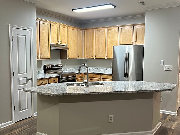 Kitchen view from family room, island provides seating for 3-5 people.