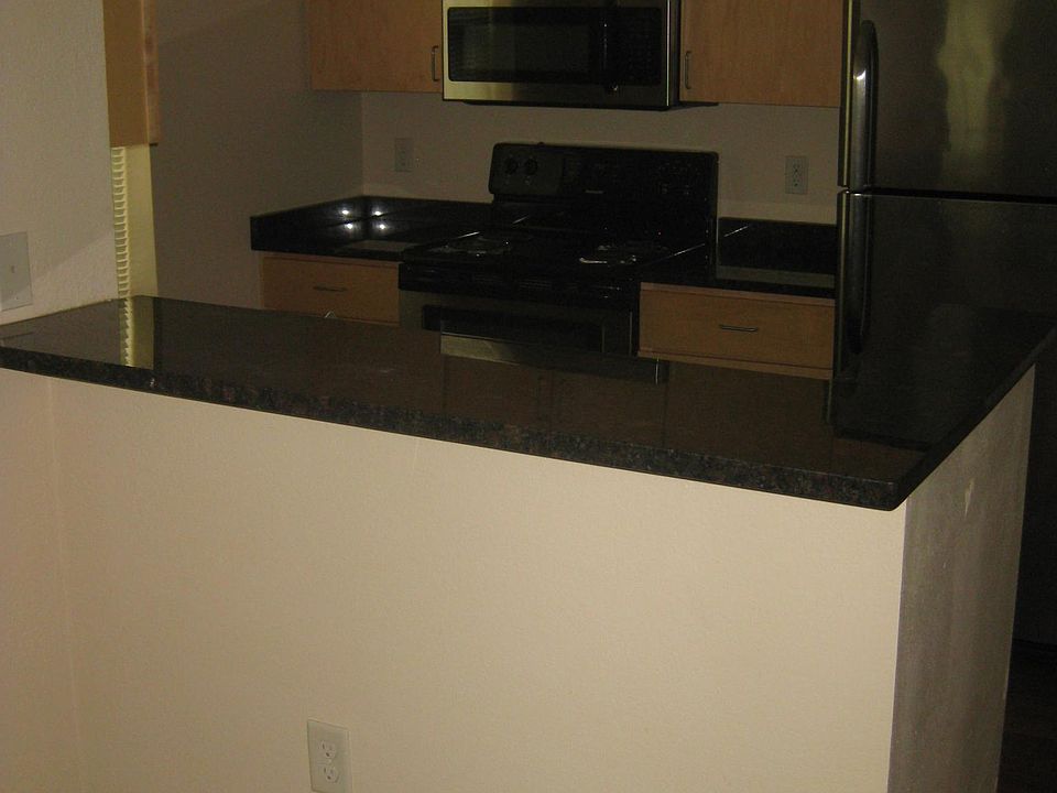 Kitchen view, granite counter tops and stainless steel appli