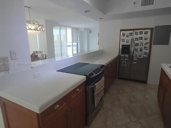3rd image of 3600 Mystic Pointe Dr APT 513