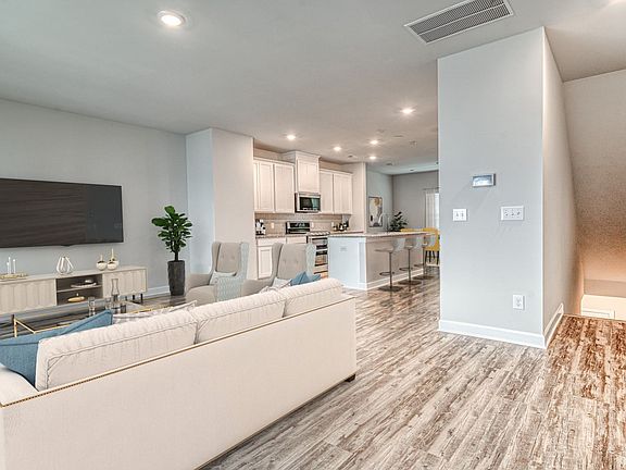 The bright, open-concept living space is perfect for entertaining or enjoying quiet nights in.