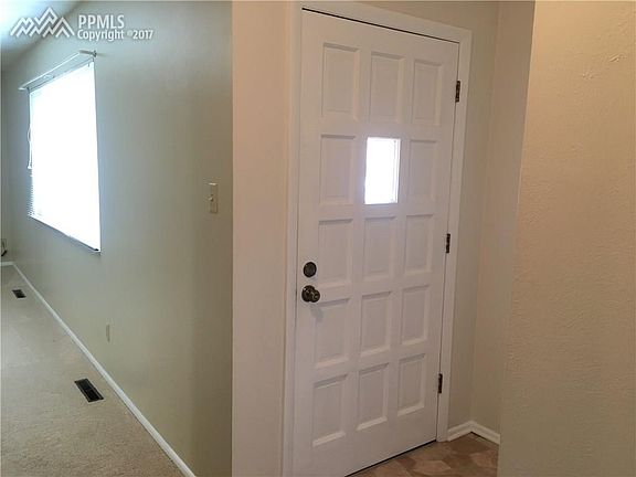 Front door iwth adjacent formal living room.
