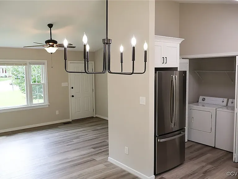Living room open into dining area and kitchen