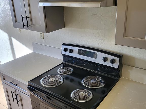 View of electric stove.