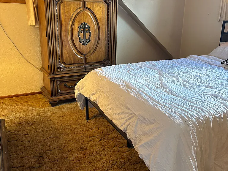 Full size bed with dresser and armoir