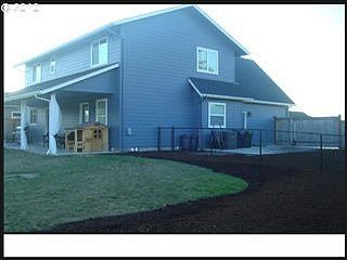 Back yard, covered patio, and dog run