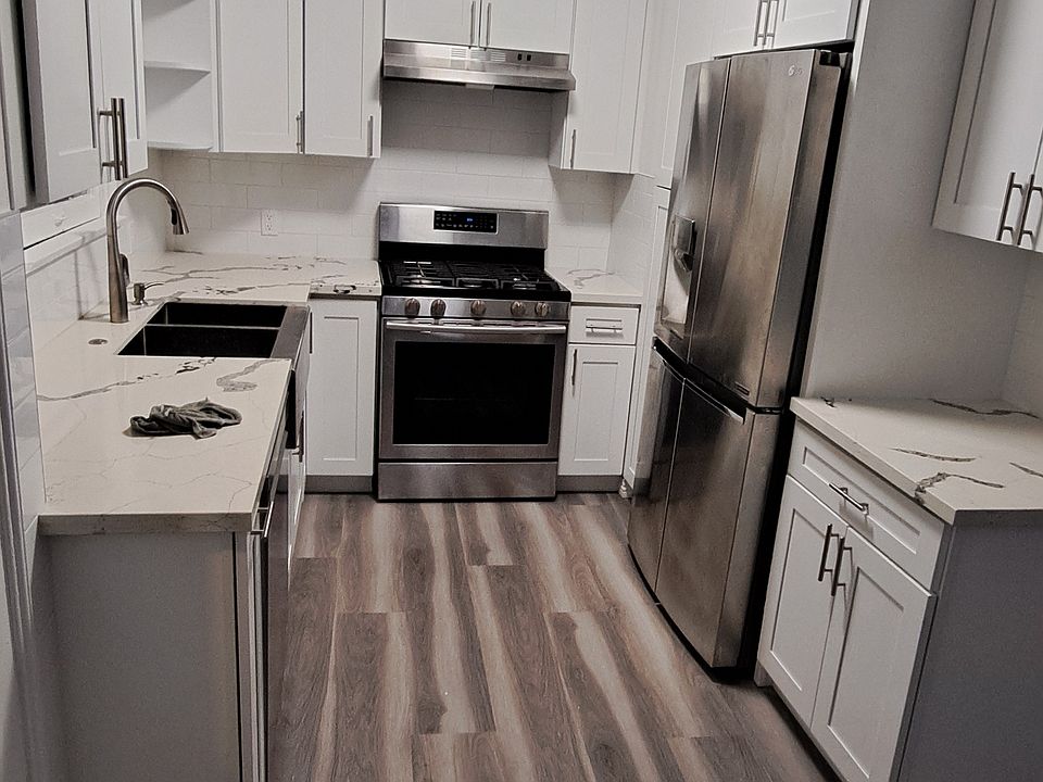 Kitchen remodel with all new cabinets, new floors and new paint. Comes with dishwasher, garbage disposal, stainless steel fridge/stove and farmers sink.