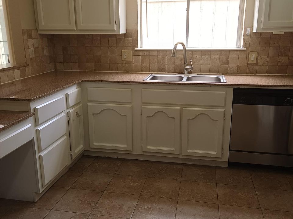 Kitchen pic with window into courtyard