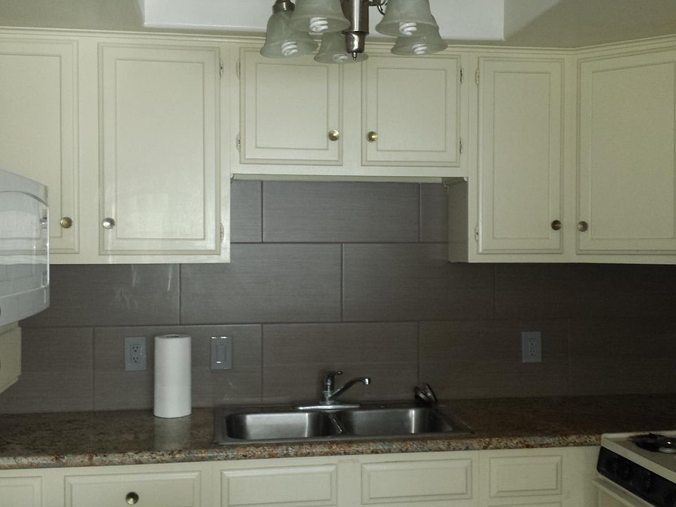Kitchen with granite and new tile backsplash