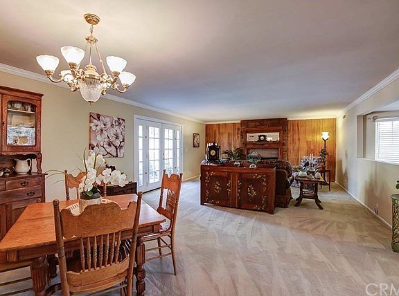 Living room and dining room with cozy fireplace.