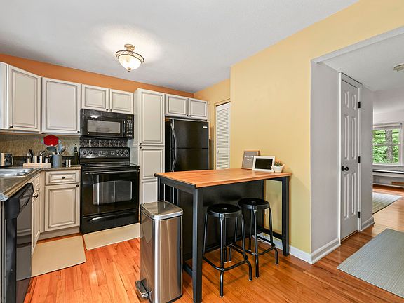 Full kitchen includes extra seating at island.