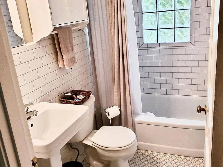One of two identical bathrooms