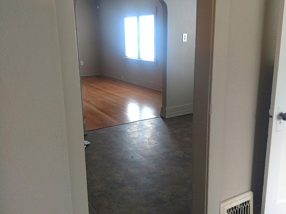 View from kitchen, looking into dining room and living room.