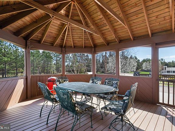Enjoy the .47 Acre Backyard on Your Screened Porch